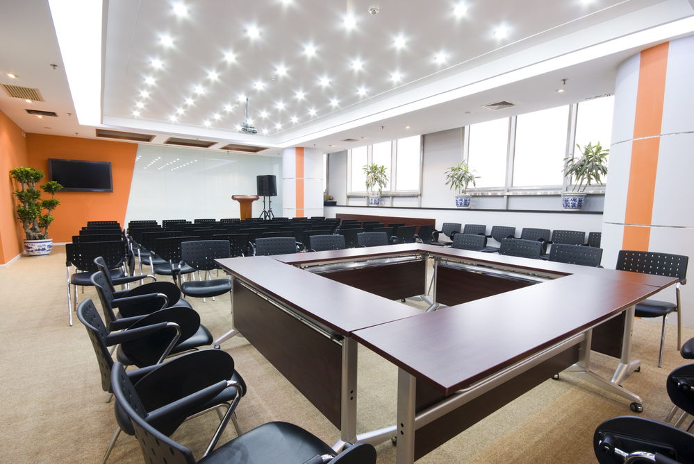 Empty modern office board room with ceiling lighting